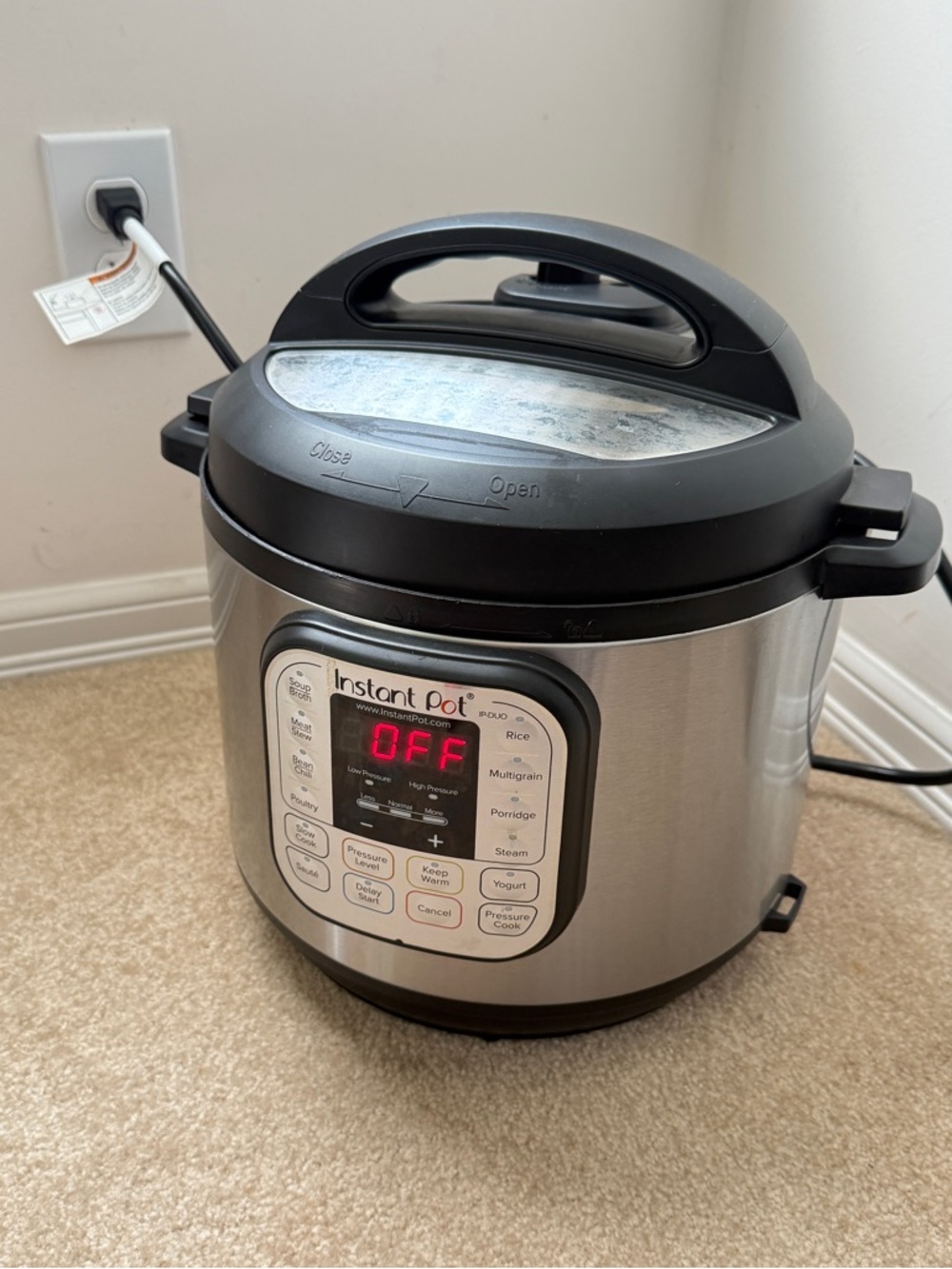 Instant Pot Electric Pressure Cooker in Silver and Black